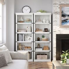 a living room filled with furniture and a clock on top of the bookcases