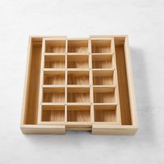 an empty wooden tray with compartments on it