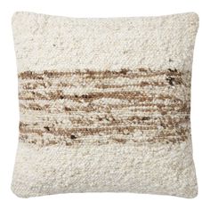 a white and brown pillow on a white background