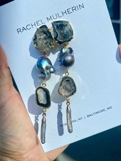 Isabel earrings are a showstopper! And SO MUCH LIGHTER than they look. We hand select the thinnest stones to give you a big statement earring without the weight. Each pair is one-of-kind because no two stones are ever the same. Features two black geode posts set in gold, black keshi pearls, another row of black geodes and an iridescent pearl detail at the bottom. Approximately 5 inches in length and beautifully hover above the collar bone. Can be requested to be smaller or larger as well. Easy t Big Statement Earrings, Iridescent Pearl, Collar Bone, Pearl Cream, Statement Earring, Keshi Pearls, Evil Eye Jewelry, Eye Jewelry, Bridesmaid Earrings