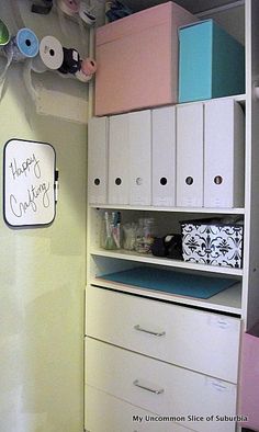 there is a closet with many items on the shelves and drawers in this small room