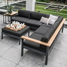 a couch and coffee table sitting on top of a patio