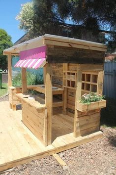 a wooden gazebo sitting on top of a wooden deck