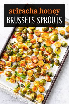 brussel sprouts on a baking sheet with text overlay that reads sriracha honey brussel sprouts