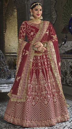 Velvet Bridal Wedding Lehenga in Red and maroon with zari work Description Style Note:- We have ensemble a symphony of enchanting piece to restyle your senses. Be the dazzling diva clad in this peach net lehenga choli with exquisite designs and patterns. This attire is crafted with thread and stonework from " "Saundaryam fashions" * Care Instructions:-Dry Clean Only.  Cost Includes Lehenga Dupatta Unstitched Choli Product Details: Fabric:Velvet Work:Stone, Thread, Zari Color Family:Red and Maroon Style:A Line Occasion:Bridal, Wedding Washing Instruction:Dry Wash This is made to order product. We customize the pattern of the dress to suit your style and fitting. Once you place the order we will provide you with a template for measurements (to be taken in inches). It usually takes a week's t Red Semi-stitched Anarkali Set With Cutdana, Red Floor-length Anarkali Set With Pallu, Red Floor-length Salwar Kameez For Transitional Season, Red Semi-stitched Anarkali Set For Reception, Anarkali Red Sharara With Pallu, Red Cutdana Lehenga For Reception, Red Floor-length Dola Silk Anarkali Set, Red Floor-length Art Silk Anarkali Set, Floor-length Red Dupatta For Transitional Season