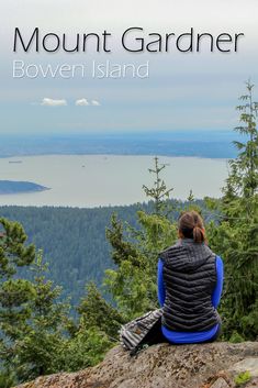 a woman sitting on top of a rock looking out at the ocean and mountains with text overlay that reads mount gardner, bown island