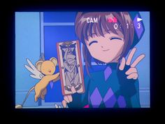 an anime character holding up a box with a stuffed animal in it's hand