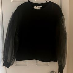 Black Mesh Sleeve Crew Neck Sweatshirt ( New With Tags) Brand: Hm Black Tops With Sheer Sleeves For Fall, Black Top With Sheer Sleeves For Fall, Fall Black Top With Sheer Sleeves, Casual Sheer Sleeves Top For Layering, Black Tops With Ribbed Cuffs For Spring, Trendy Black Top With Sheer Sleeves, H&m Crew Neck Tops For Fall, H&m Long Sleeve Sweatshirt For Spring, Black Tops With Sheer Sleeves For Layering