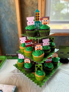 cupcakes are arranged in the shape of a christmas tree with green frosting