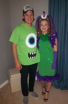 two people in costumes standing next to each other