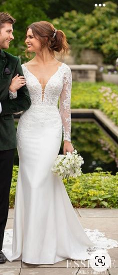 the bride and groom are walking together outside