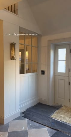 an empty room with two doors and carpet on the floor in front of it that says, a nearly finished project