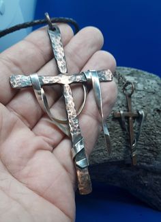 "\"He is not here, for He has risen!\" The 925 solid sterling silver drape represents the burial wrap He left behind. Each one is a unique piece of handcrafted art. Hand formed and textured cross of 99.9% pure copper. I apply an oxidizing agent to create an antique patina, then buff, polish and apply a coat of Renaissance Jewelers Wax Soldered bail loop 3mm braided leather cord with handmade copper clasp. Also available with soldered 5x8mm copper chain with antique copper lobster claw catch Sele