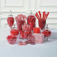 a table topped with lots of candy and candies