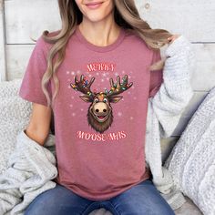 A festive Christmas T-shirt featuring a funny moose design with the message 'Merry Moosemas'. This unisex jersey short sleeve tee is perfect for spreading holiday cheer and adding a touch of humor to your wardrobe. Ideal for those who enjoy playful and quirky holiday attire. Product features - Unisex fit for versatile styling - Made with lightweight and breathable 100% Airlume combed and ring-spun cotton - Ribbed knit collar with seam for shape retention - Shoulder tape for added durability - Pe Moose Shirt, Funny Moose, Moose Christmas, Christmas Moose, Dashboard Header, Holiday Attire, Knit Collar, Christmas Shirt, Christmas Tshirts