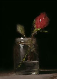 a single red rose sitting in a glass vase on a table top with dark background