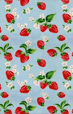 a blue background with strawberries and flowers on it