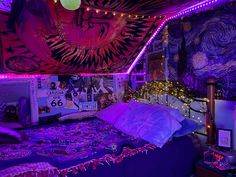 a bed room with a neatly made bed and purple lights on the ceiling above it