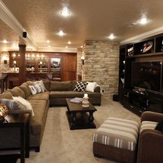 a living room filled with furniture and a flat screen tv