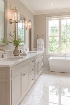 a large bathroom with two sinks and a bathtub