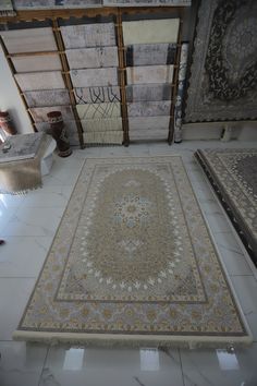 a large area rug in the middle of a room with multiple pieces of carpet on the floor