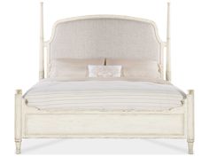 a white bed with two pillows on top of the headboard and foot board in front of it