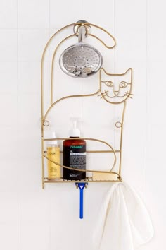 a bathroom shelf with a shower head and soap dispenser attached to it