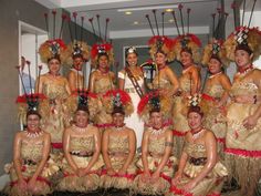 a group of women dressed in costumes posing for a photo