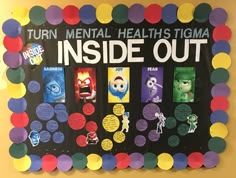 the inside out bulletin board is decorated with colorful paper circles and cartoon character stickers