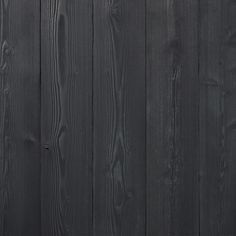 an image of a black wood fence that looks like it has been painted