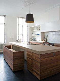 an island in the middle of a kitchen