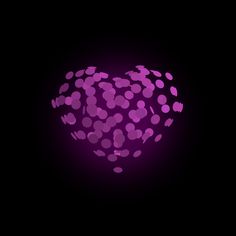 a purple heart shaped object with lots of small dots on the surface in front of a black background