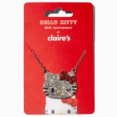 Do you love Hello Kitty®? We know we do! Wear her everywhere with this necklace. The silver-tone chain has an embellished Hello Kitty® face with her iconic red bow. Pendant Necklace by Hello Kitty® Claire's Exclusive Finish: Silver-toneNecklace Length: 16 in. / 40.64 cm.Closure: Lobster claspMaterial: Metal - Hello Kitty® 50th Anniversary Claire's Exclusive Silver-tone Pendant Necklace Hello Kitty Face, Hello Kitty Shop, Piercing Kit, Bow Pendant, Fashionable Jewelry, Hello Kitty Items, Hello Kitty Collection, Jewelry Lookbook, Red Bow