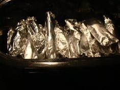 foil wrapped in aluminum foil sitting on top of a stove