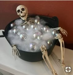 a skeleton in a bathtub filled with bubbles and soapy water for halloween decorations