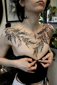 a woman with a tattoo on her chest