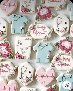 decorated cookies are arranged in the shape of doctors and nurse's shirts with flowers on them