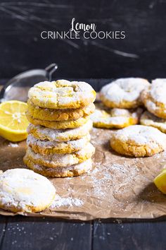 lemon crinkle cookies stacked on top of each other next to sliced lemons