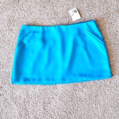 Lined Mini Skirt Bright Beautiful Aqua Blue Side Pockets Never Worn Perfect Condition Blue Mini Skirt With Pockets, Blue Stretch Mini Skirt With Pockets, Stretch Blue Mini Skirt With Pockets, Blue Mini Skort With Pockets, Trendy Blue Mini Skort, Blue High-waisted Flowy Skort, Blue Stretch Skort For Spring, High-waisted Blue Flowy Skort, High Waist Blue Flowy Skort