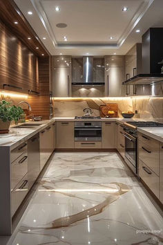 a kitchen with marble flooring and wooden cabinetry in the center is lit by recessed lighting