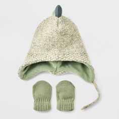 Give your baby an extra adorable look on cool-weather days with the Dinosaur Hat and Mitten from Cat & Jack™. The knitted hat features dinosaur horns and matching mittens to offer both style and warmth. Made from midweight knit fabric with full lining, they provide a soft feel and comfortable fit for your baby. Plus, the hat features a chinstrap hook-and-loop fastener to help you dress them with ease. Cat & Jack™: Designed for all children so you can trust it's made for yours. Dinosaur Hat, Bear Hat, Knitted Romper, Pom Pom Hat, Boy Clothes, Knitted Hat, Baby Bear, Lining Fabric, Baby Boy Outfits