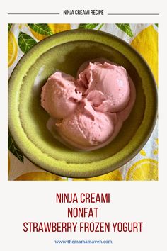 a green bowl filled with ice cream on top of a table