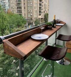 a table with two plates on it in front of a window overlooking a cityscape