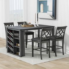 a dining room table with chairs and a wine rack