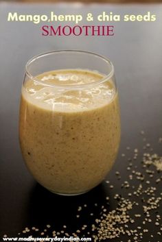 a smoothie is in a glass on a table