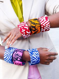 Large African Wax prints bangles Compliment the look with these handmade African bangles. Made with light wood and Traditional African wax print. PS: These bangles fit wide/ Large. So, wouldn't fit slimer wrists Colour: multi pattern prints Details: . Handmade item . Wide fit . Bracelet width: 5 Cm . Weight: 38g . Materials: Wood and cotton prints . Style: colourful Please note that this item needs to be removed prior to showering, swimming or anything that could result in the fabric being damag Handmade Multicolor Bangle, Multicolor Hand Painted Bangle Bracelets, Multicolor Hand Painted Bangle Bracelet, Hand Painted Multicolor Bangle Bracelet, Multicolor Hand Painted Bangle, Hand Painted Multicolor Bangle, African Bangles, Fabric Bangles, African Accessories