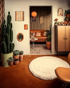 a living room filled with lots of furniture and cactus plants on the wall next to it