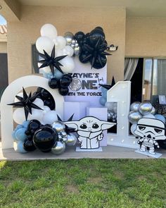 star wars themed birthday party with balloons and decorations