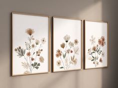 three framed art pieces with flowers on them