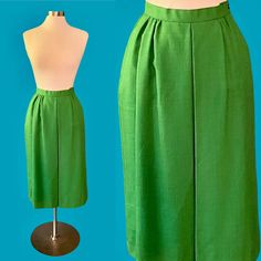 Vintage 80's Worthington bright green midi skirt *ITEM DETAILS* - Era- 1980's - Brand- Worthington  - Material- SHELL-50% Rayon 50% Polyester LINING- 100% Nylon  - Color- Bright Kelly green - Size- 10 (please see the measurements for an accurate fit)  - Fully lined - Side zipper and button closure *This item is in excellent (pretty much perfect!) vintage condition with no holes or stains.* *shown here on a size 6-8 mannequin, it was pinned about an inch at the waist* *measurements taken while fl Green Midi Length Lined Skirt, Green Lined Midi Skirt, Green Midi Length Workwear Bottoms, Vintage Green Skirt For Spring, Vintage Green Skirt For Summer, Vintage Green Summer Skirt, Retro Green Midi Skirt, Retro Green Knee-length Skirt, Green Retro Knee-length Skirt